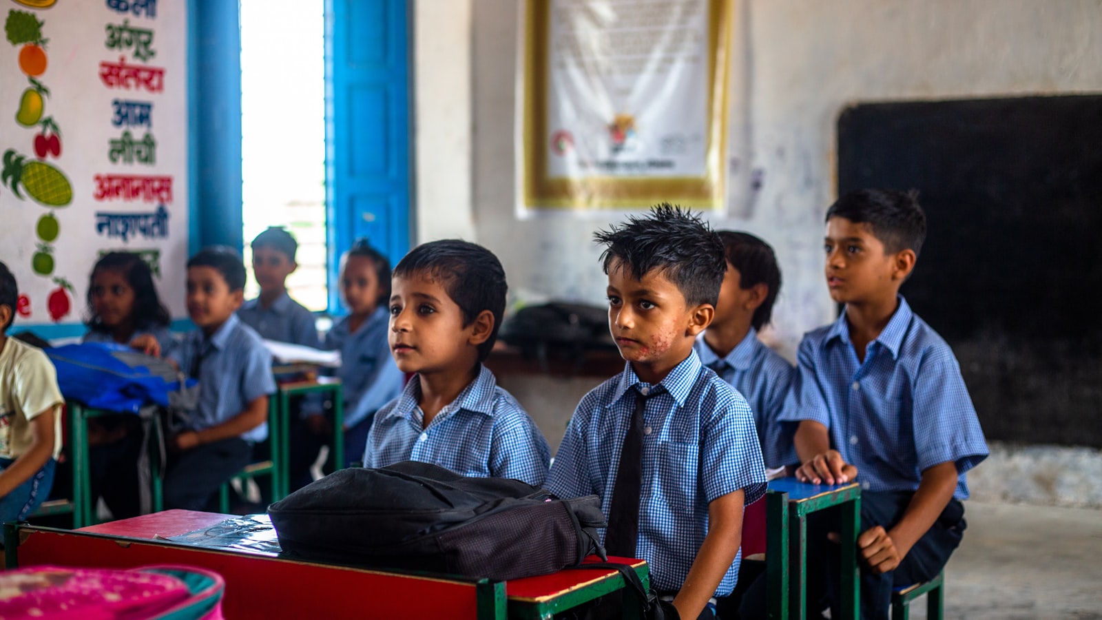 Children seated attentively in a classroom
